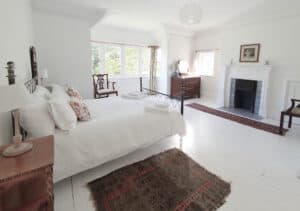 Big bedroom with antique furniture in holiday house