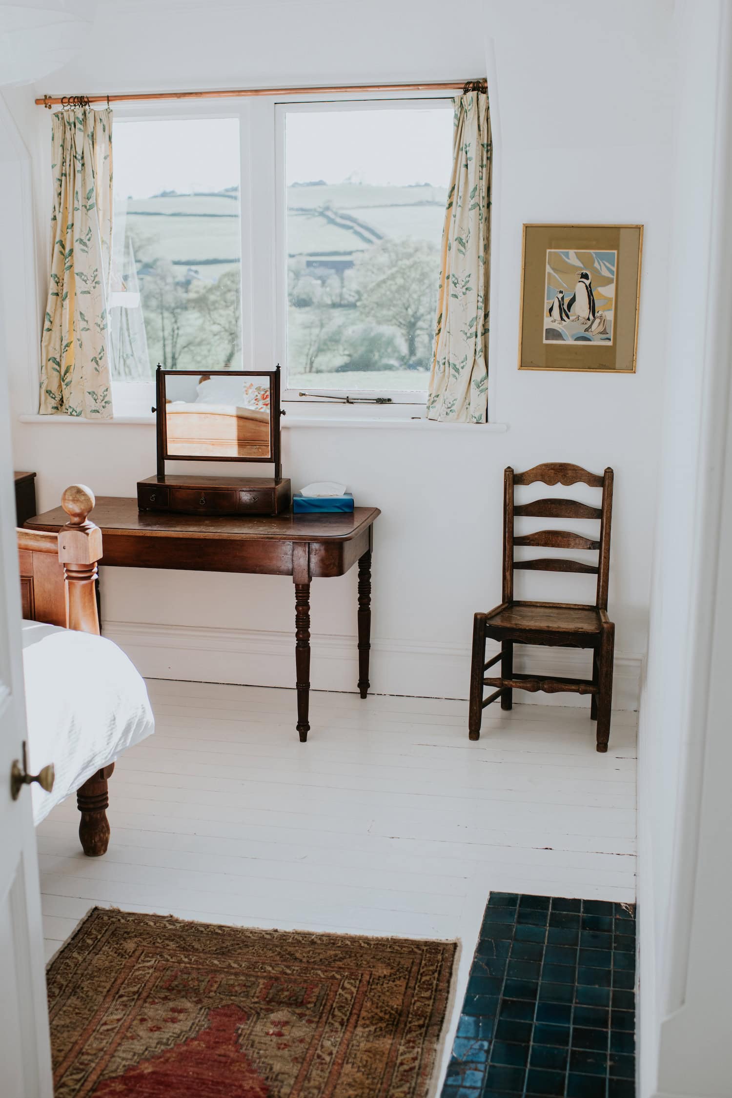 Charming interior with vintage furniture overlooking scenic Dorset coast views.