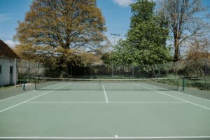 Tennis courts at Rushay with scenic coastal views on the Dorset coast in England.