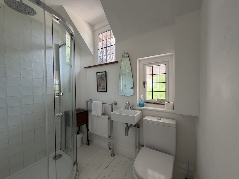 Shower room with two leaded light windows